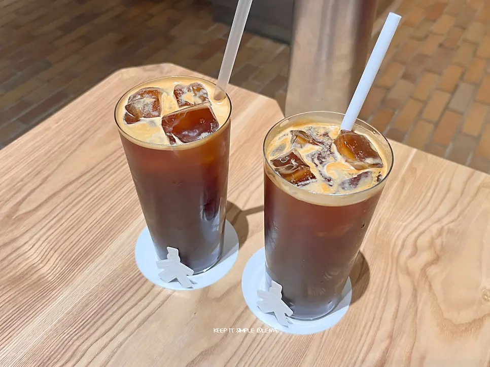Small-sized iced americano cup with a person-shaped sticker