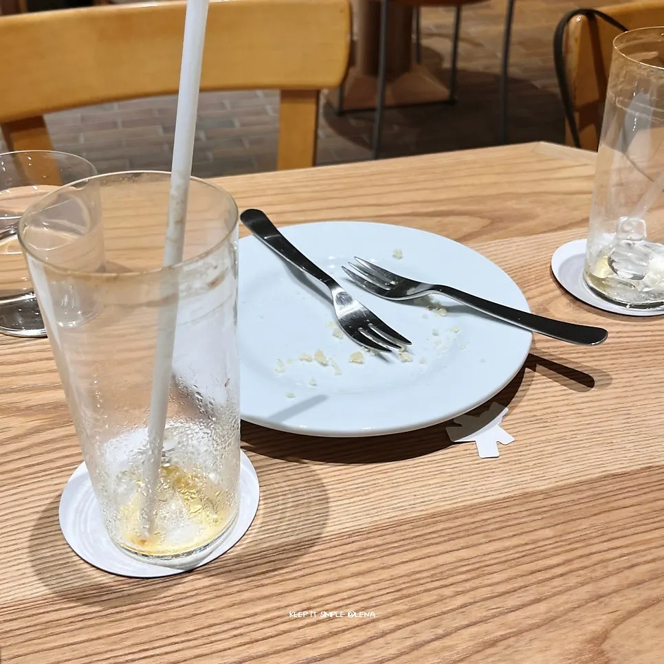 Nearly finished americano with the remaining biscuit