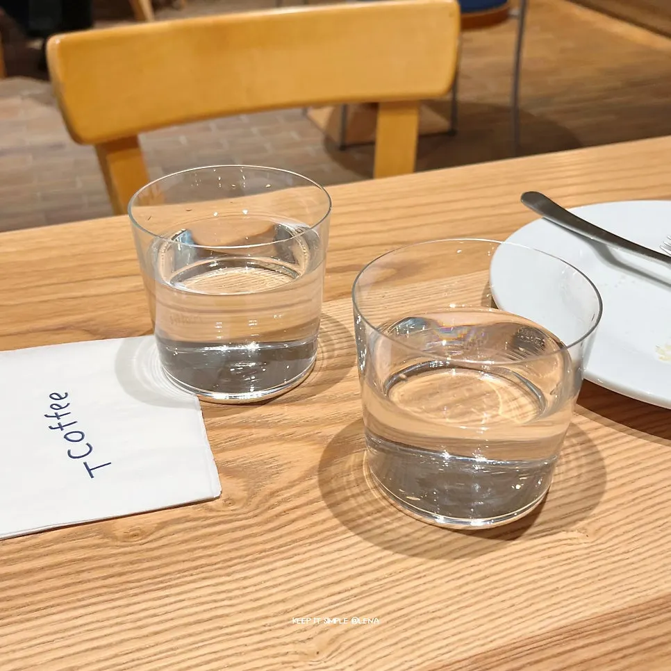 T Coffee's thin, large water glass
