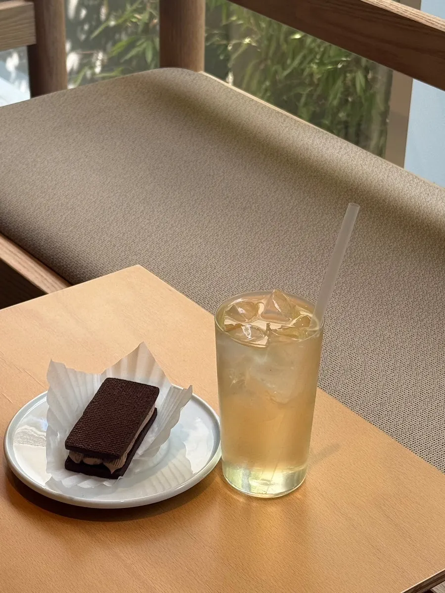 Table setting of lemon shiso mugwort tea and chocolate butter sand