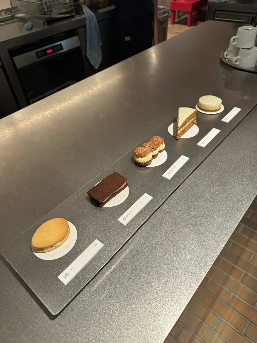 T Coffee menu board with coffee and non-coffee drinks
