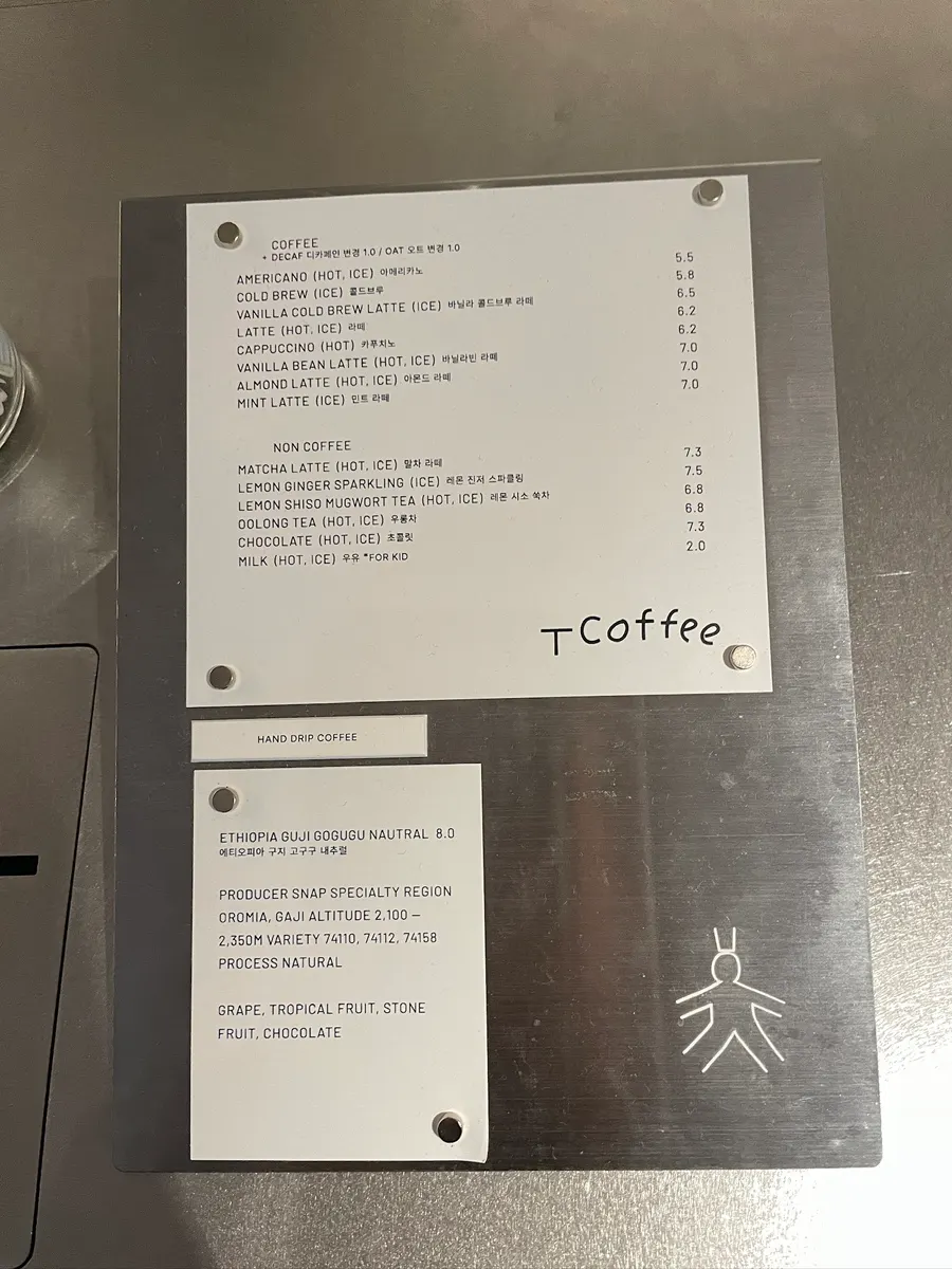 T Coffee's stainless-steel-mood coffee menu board