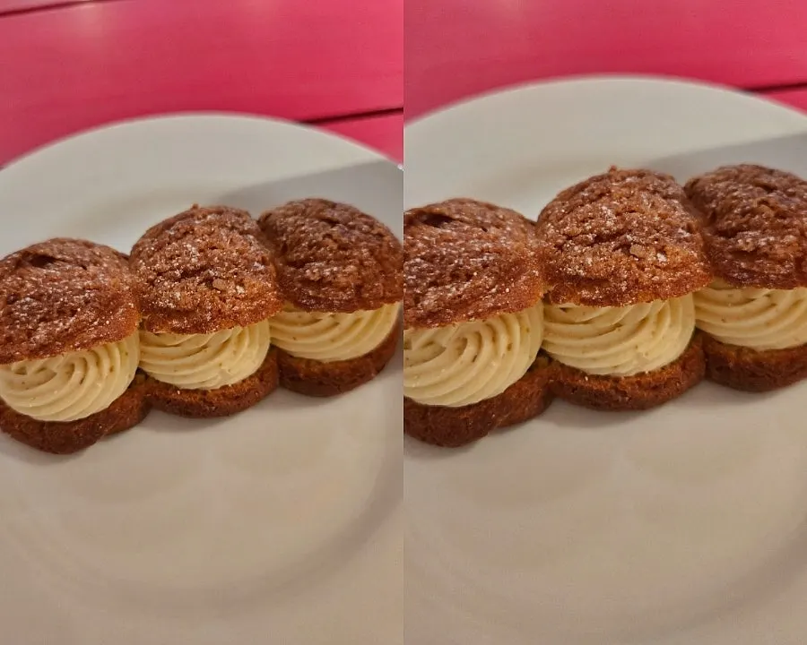 Table shot of the ordered vanilla cold brew latte and pistachio cream puff