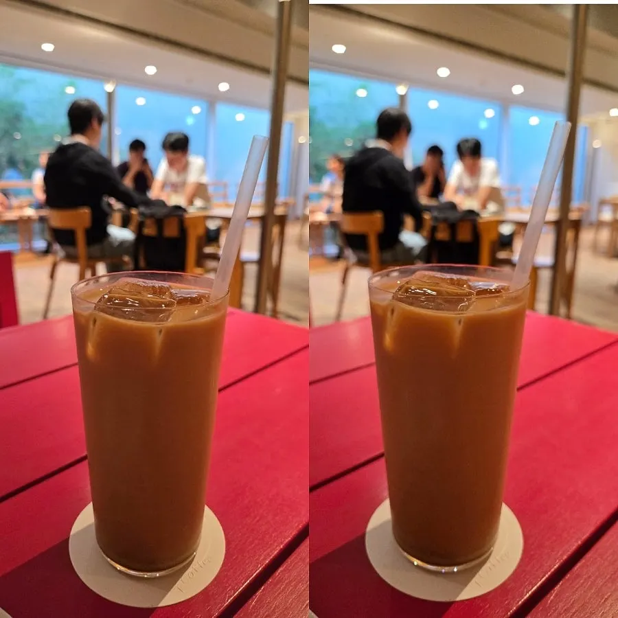 A glass of vanilla cold brew latte with ice