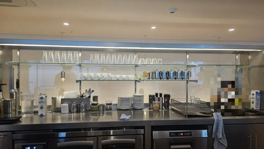 Barista preparing coffee at the bar