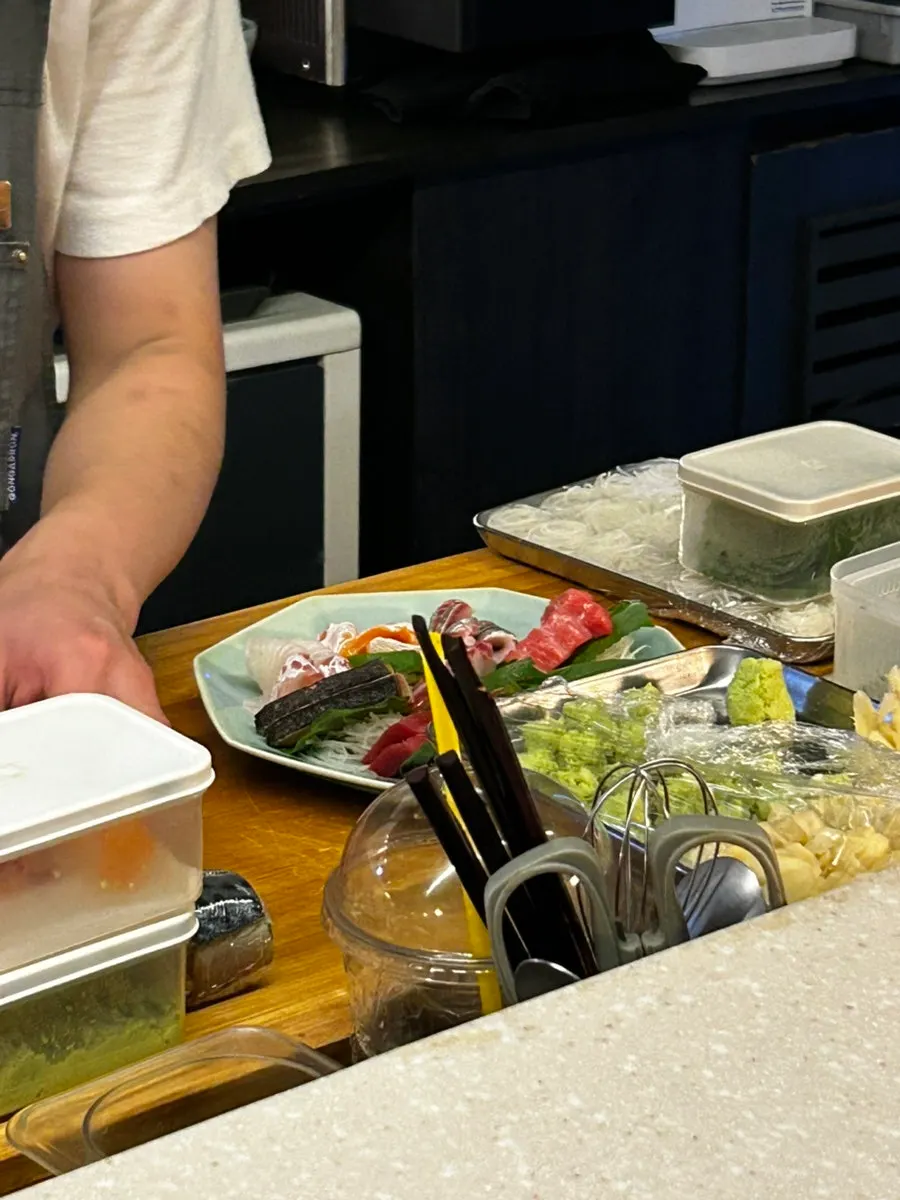 Sashimi preparation in front of the bar seats
