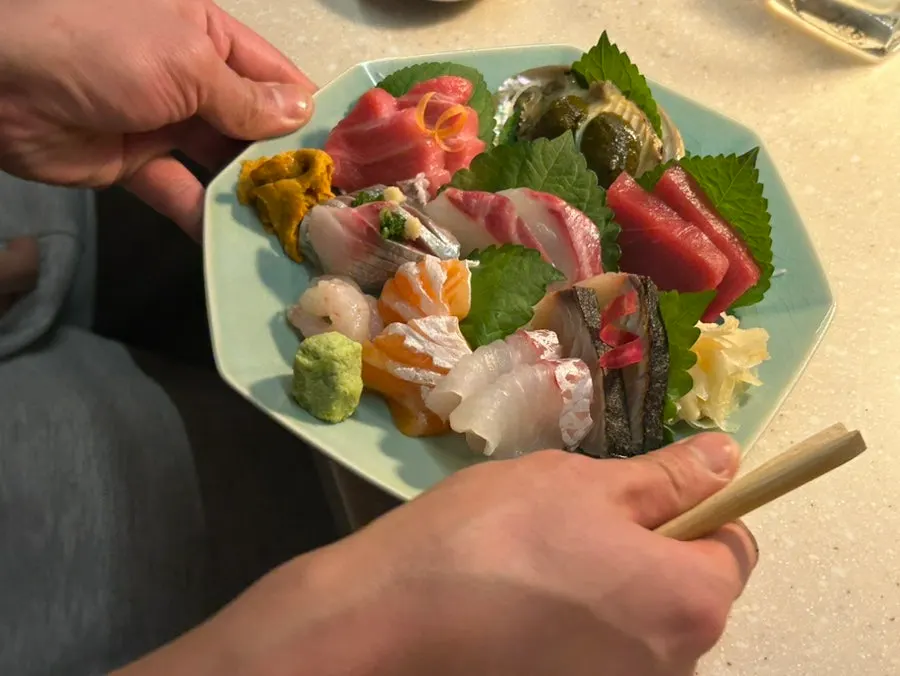 Watching sashimi preparation from the bar table