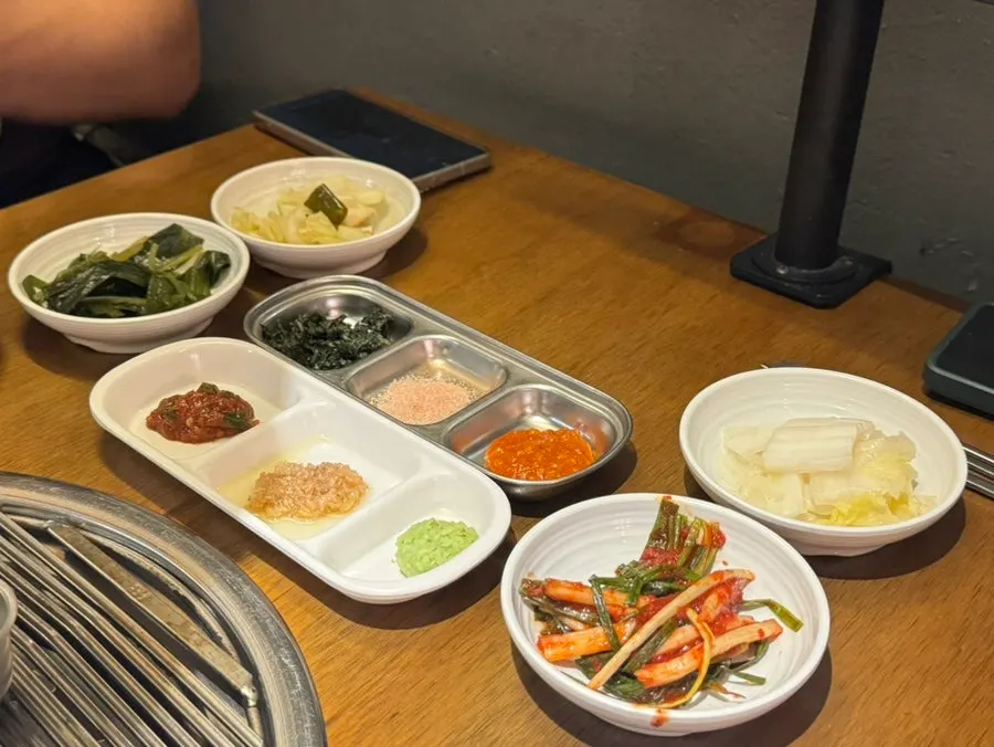 Table set with Seongsu Teojeon's banchan and sauces