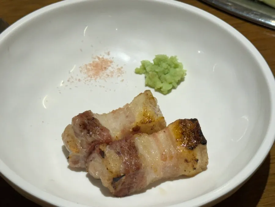 Bite-sized pork belly grilled by staff