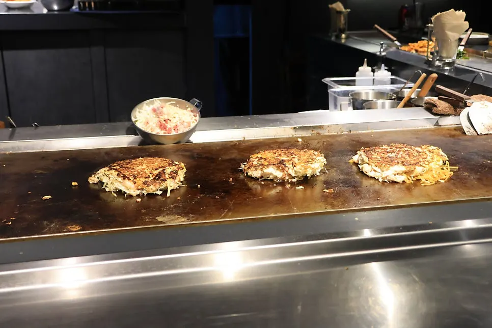 Dishes cooking on the teppan grill