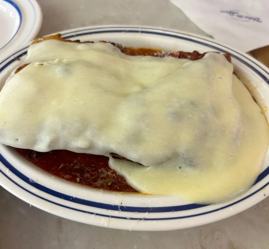 Aligot cheese lasagna cheese-pouring presentation