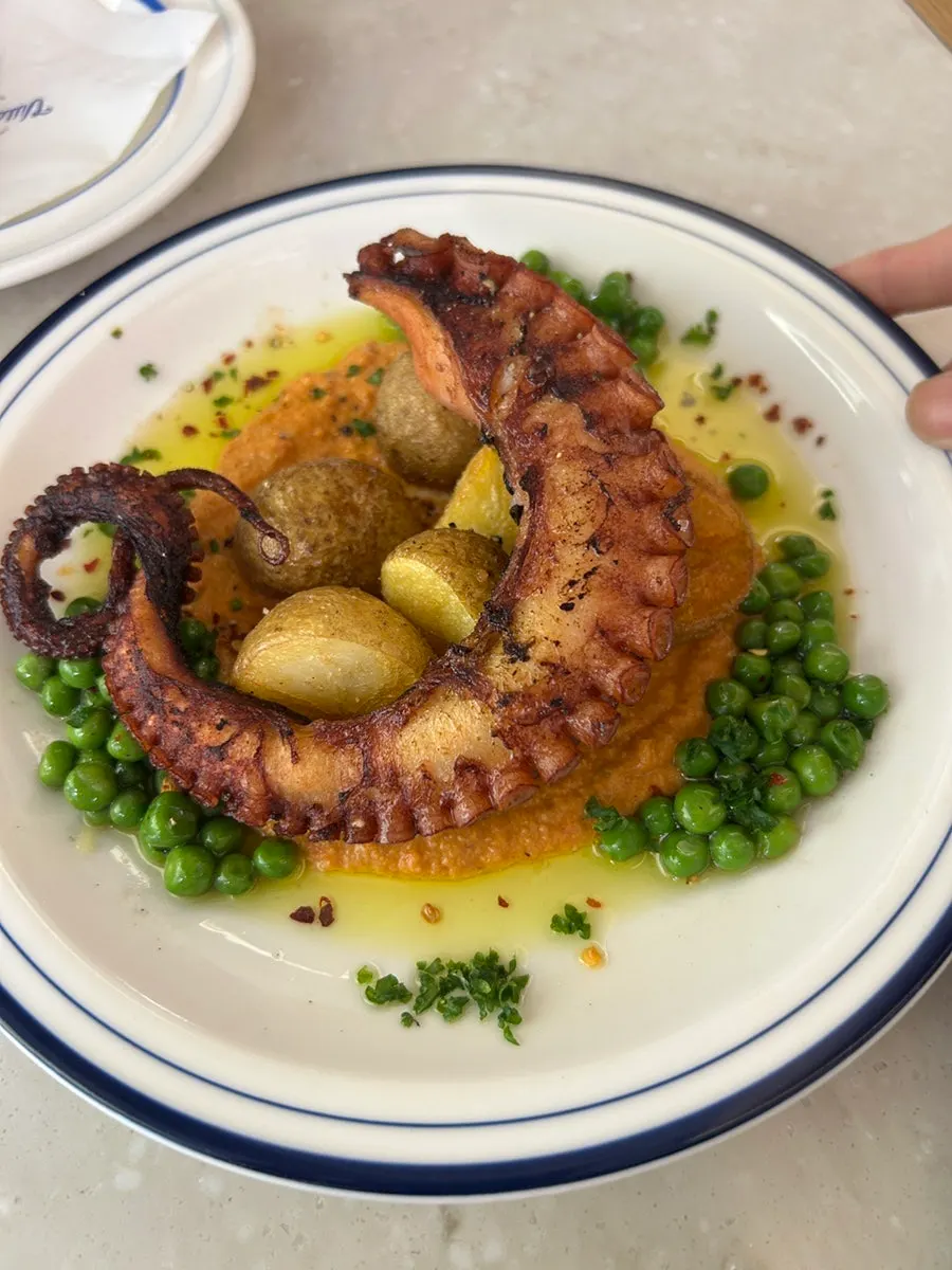 Mediterranean octopus dish with peas