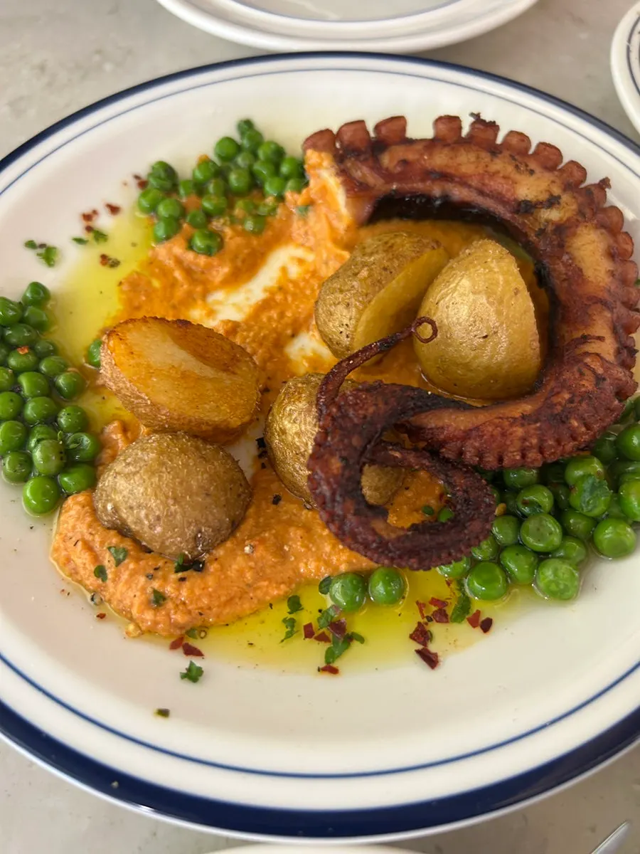 Eating a tender octopus dish