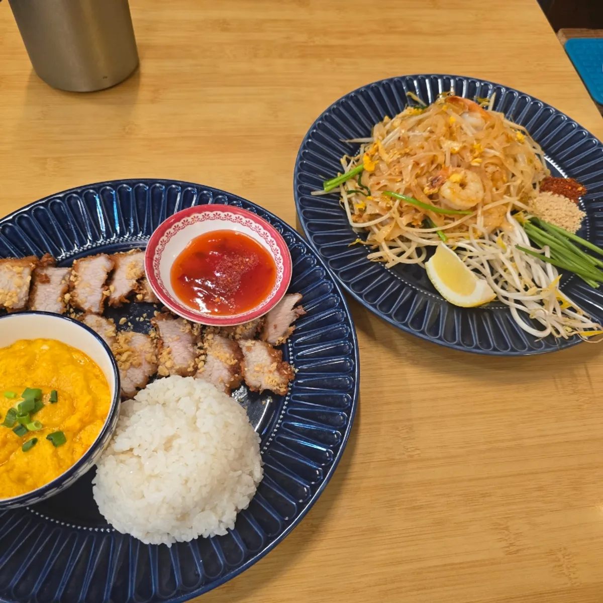 Pork jowl fritters, curry, and pad thai combined on the table