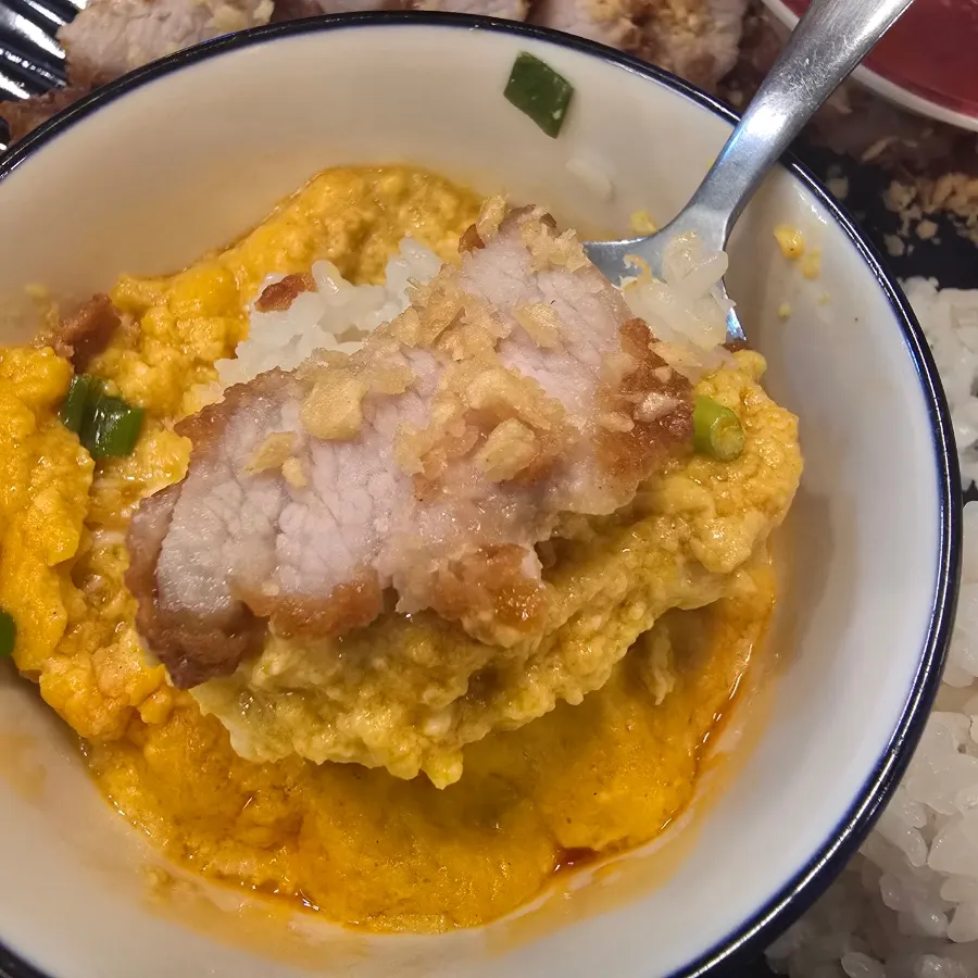Pork jowl fritter with a white cross-section, curry, and white rice