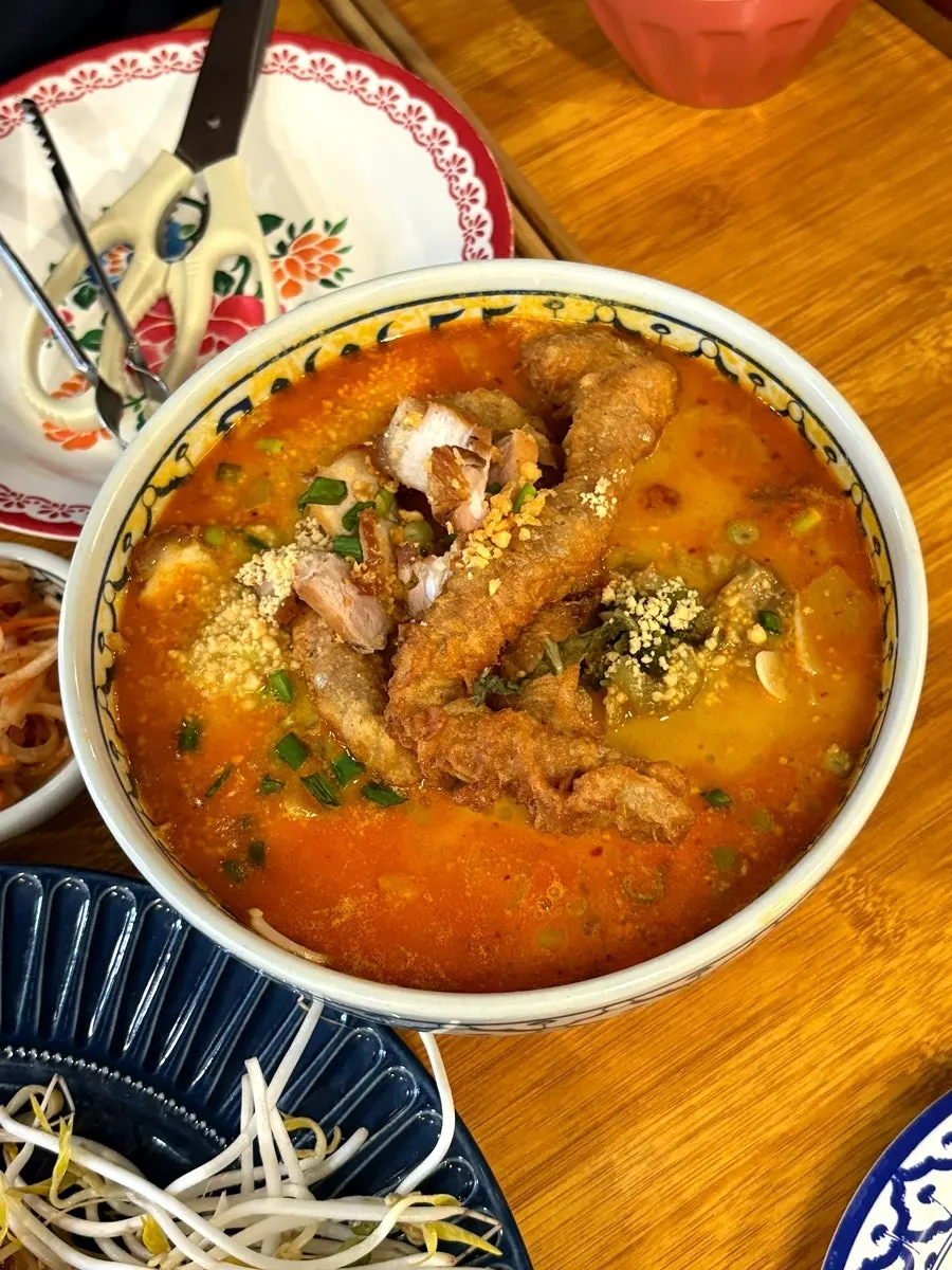 Curry tripe pho topped with fried tripe