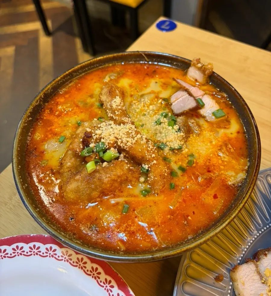 Curry tripe pho topped with fried tripe