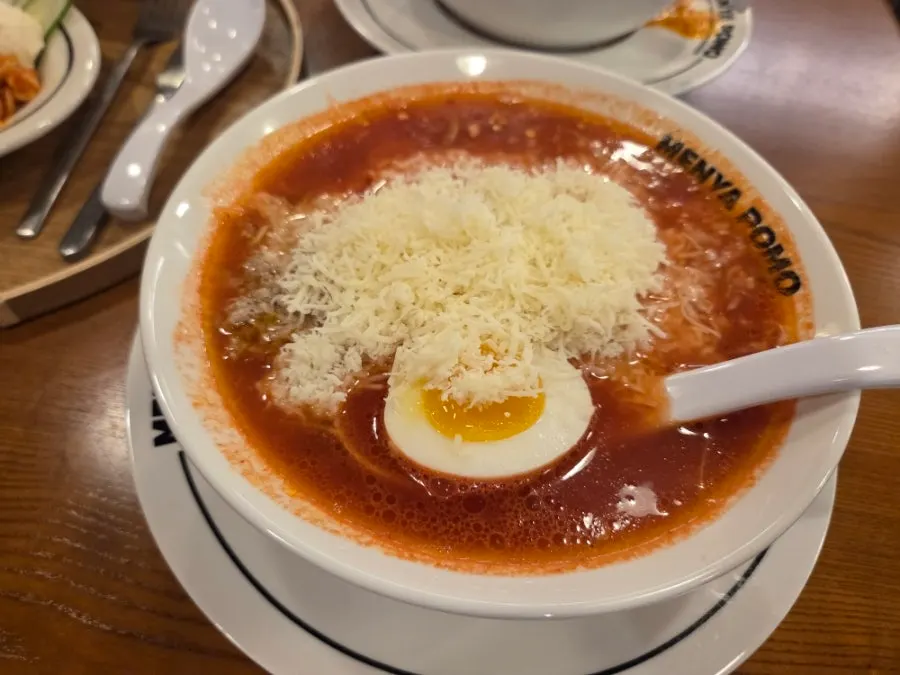 A bowl of cheese tomato ramen