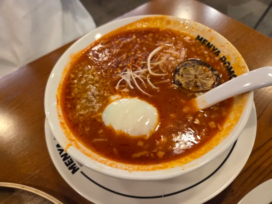 A bowl of tom yum tomato ramen