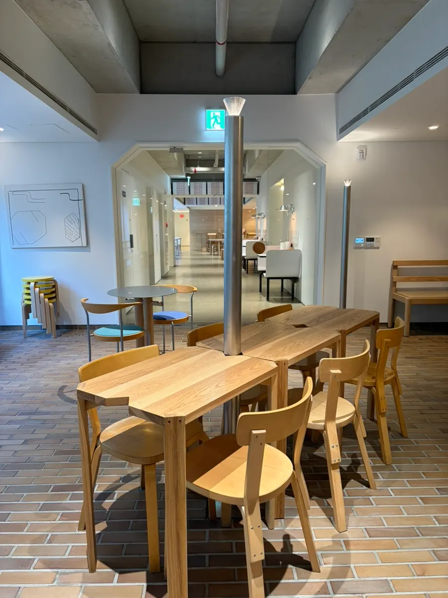 A stand lamp rising over a table