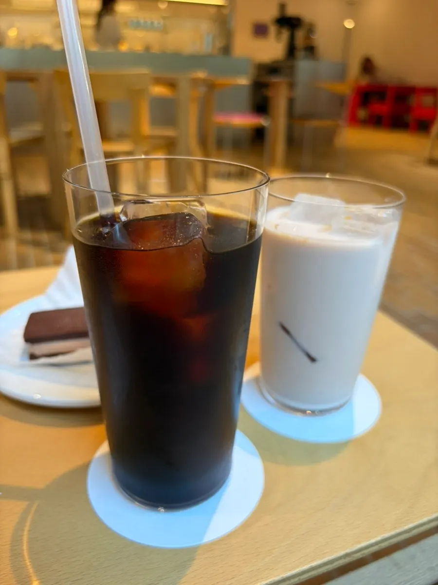 Two glasses of iced cold brew and vanilla chai tea