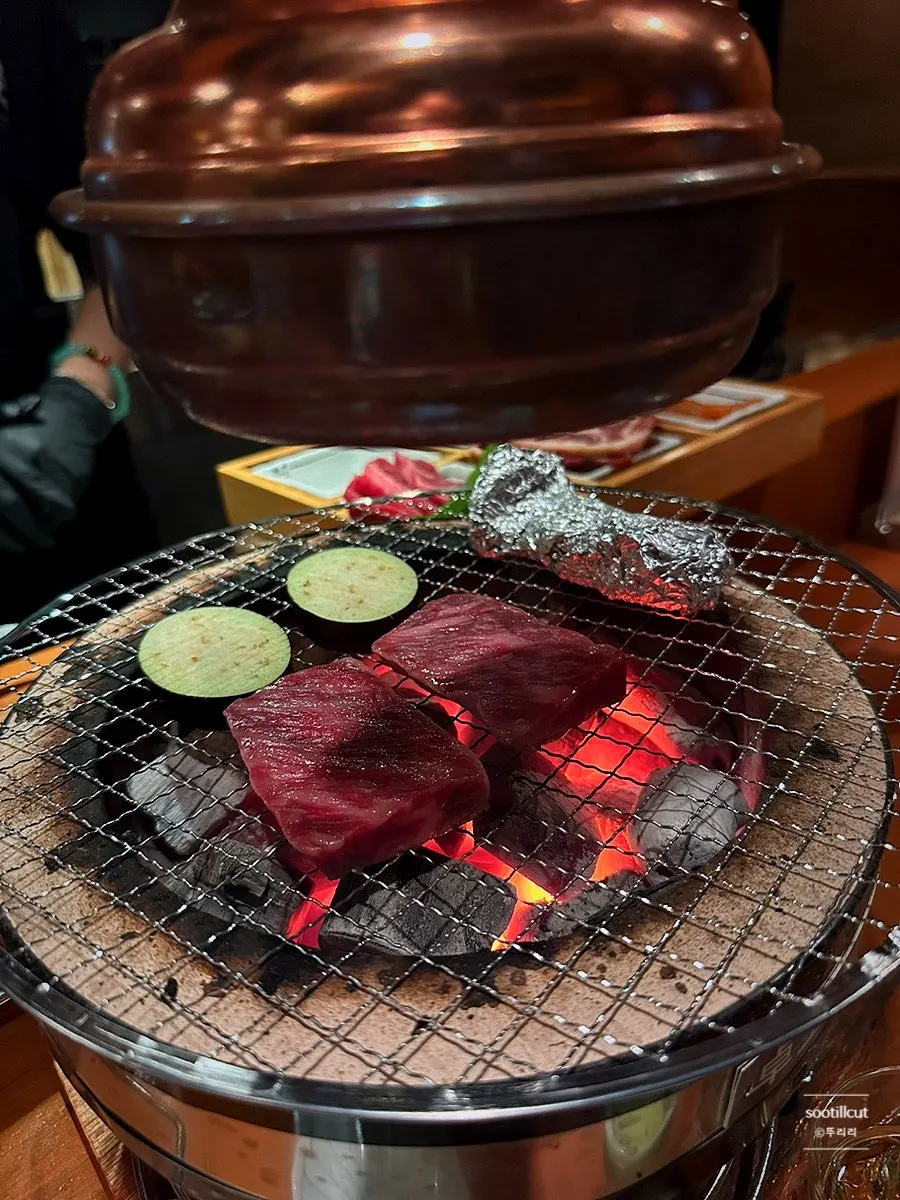 Beef tongue course grilling over charcoal