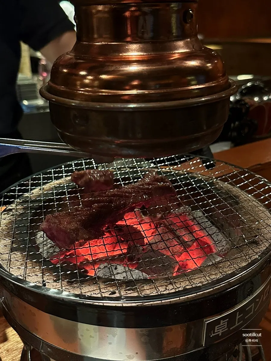 Short rib grilling over the brazier
