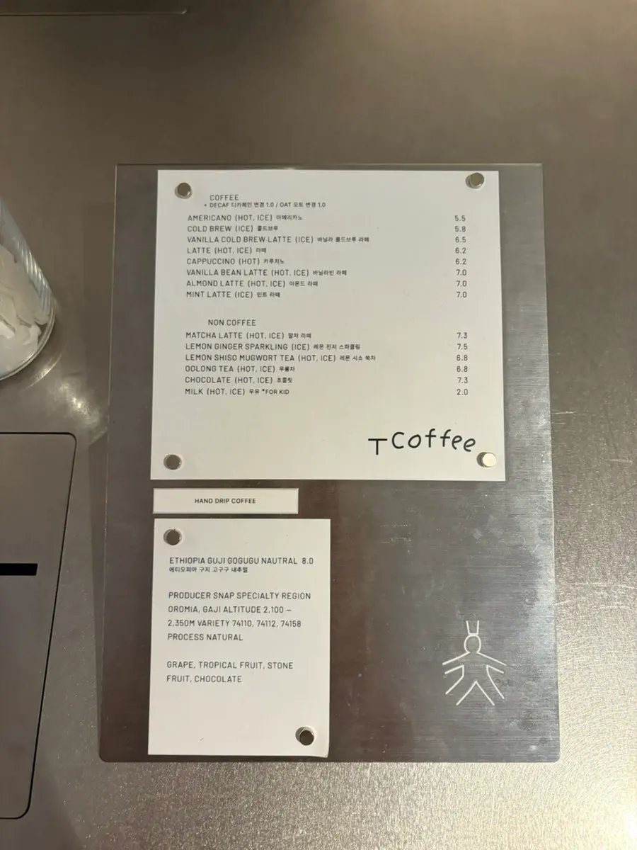 T Coffee's drink menu board