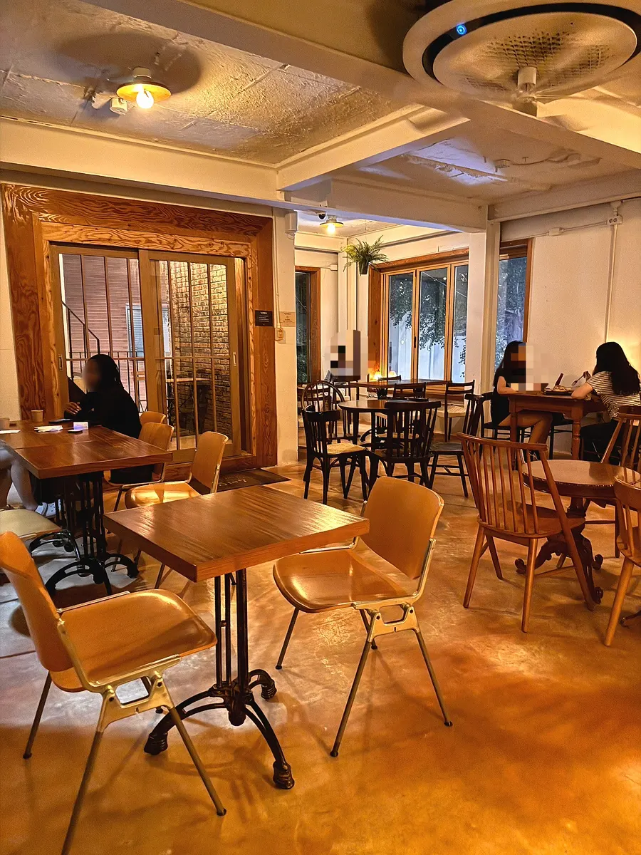 2nd-floor window-view seats overlooking trees at 5to7 Seongsu Main Branch