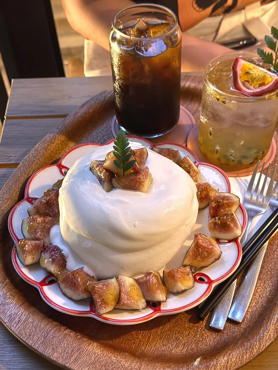Enjoying soufflé and drinks at a window seat