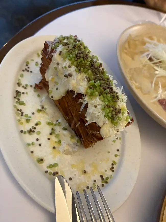 Potato pavé with perilla seeds and scallions