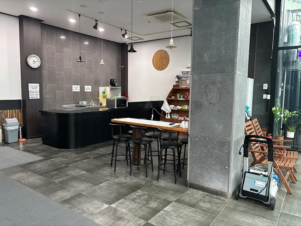 Indoor barbecue area behind the pool