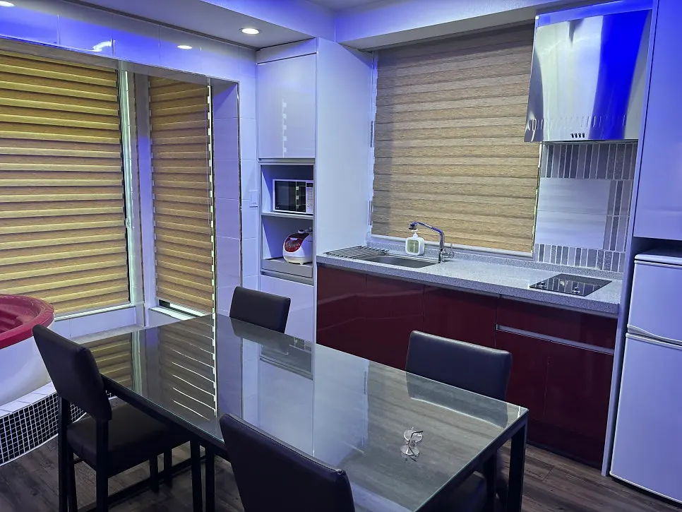 Area with a refrigerator for guests’ storage