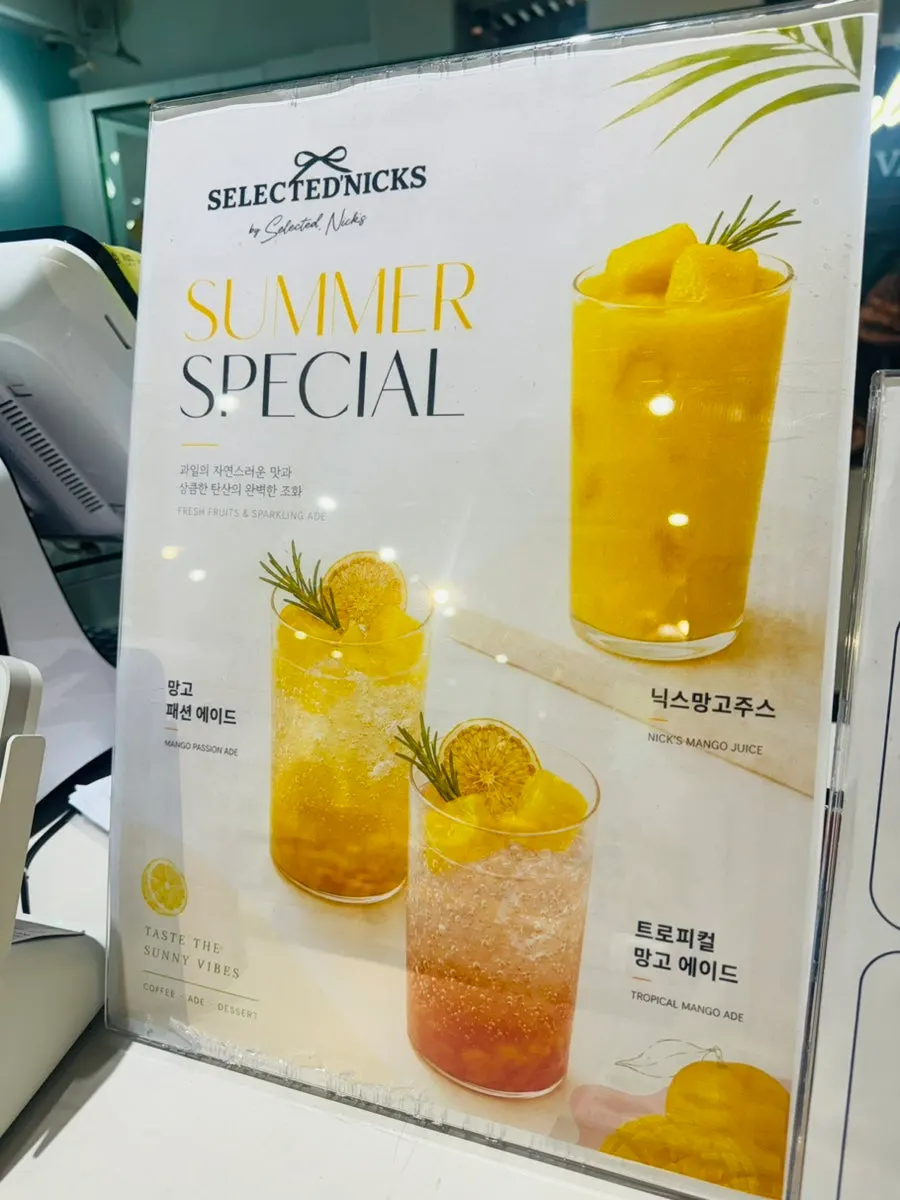 Coffee and beverage menu board at Selected Nicks