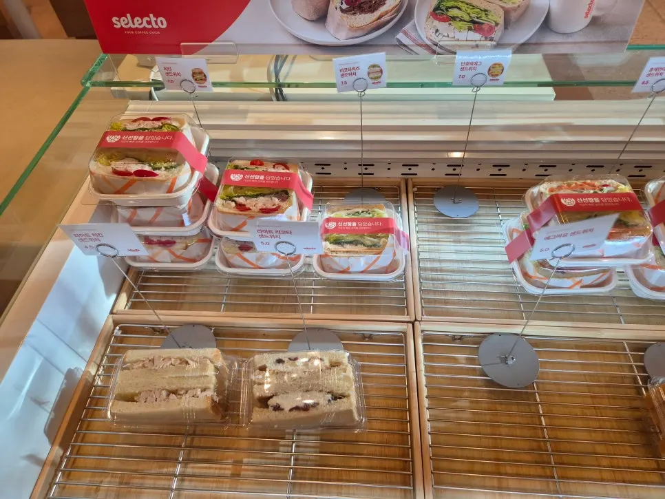 Display case with cakes and bagels