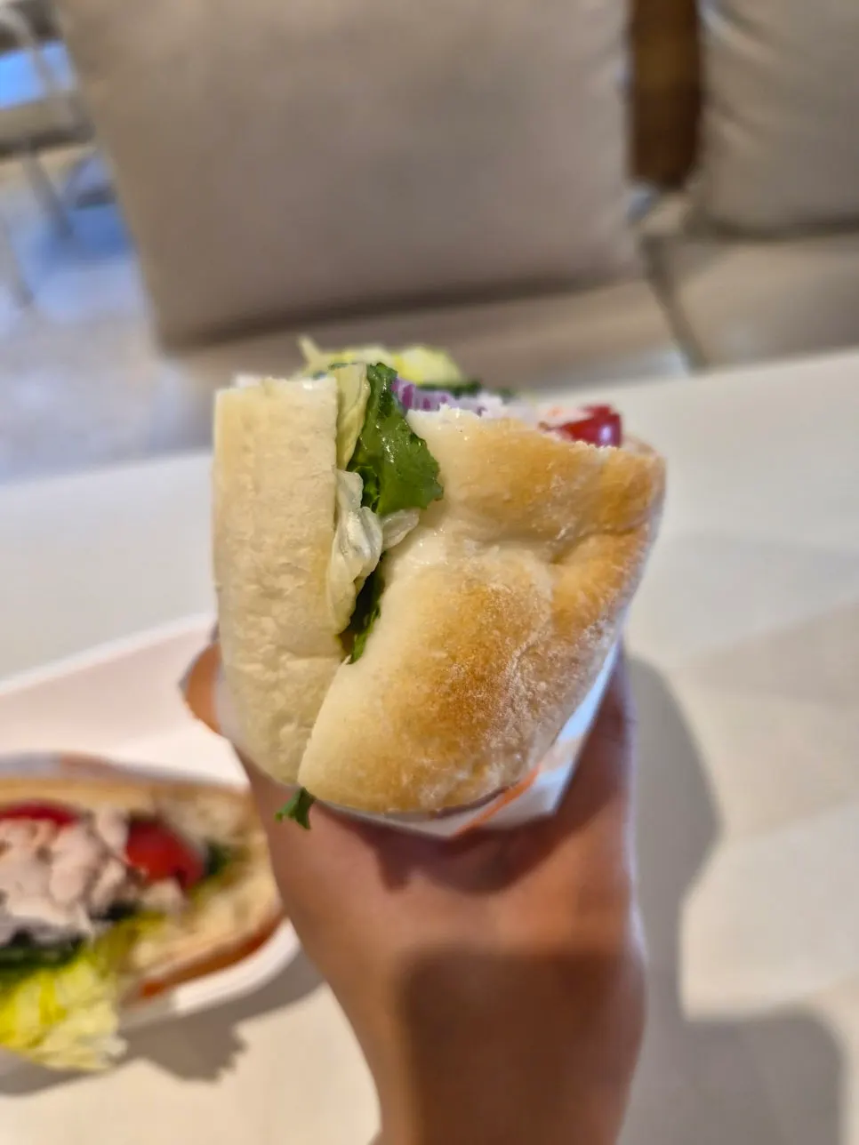 Cross-section of the chicken sandwich with lettuce and tomato