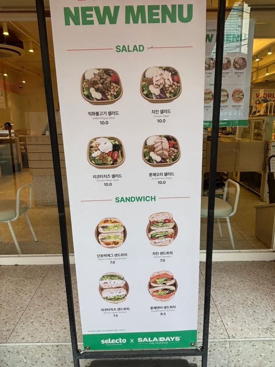 Salads and sandwiches displayed in the showcase
