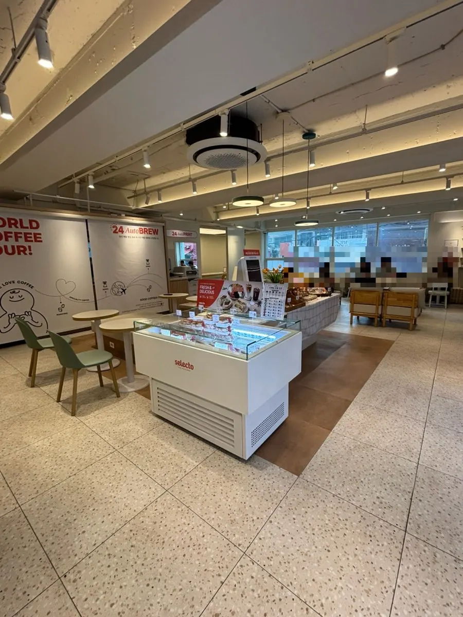 Café interior seating with spaced-out tables