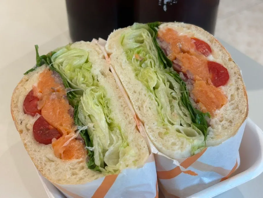 Smoked salmon sandwich packed with cabbage