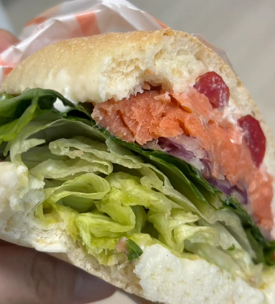 Cross-section of the smoked salmon sandwich on ciabatta bread