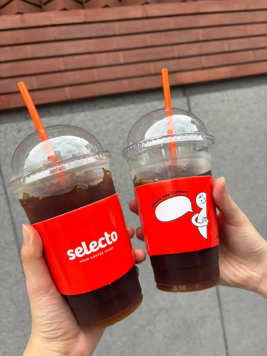 Leftover coffee poured into a takeout cup