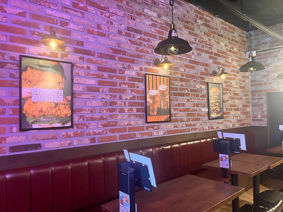 Dining hall seating at BAS Burger Seonyudo with generous table spacing