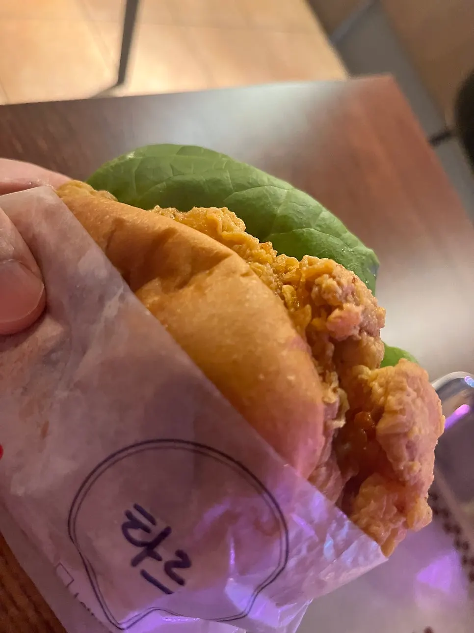 Holding a handmade burger from BAS Burger Seonyudo