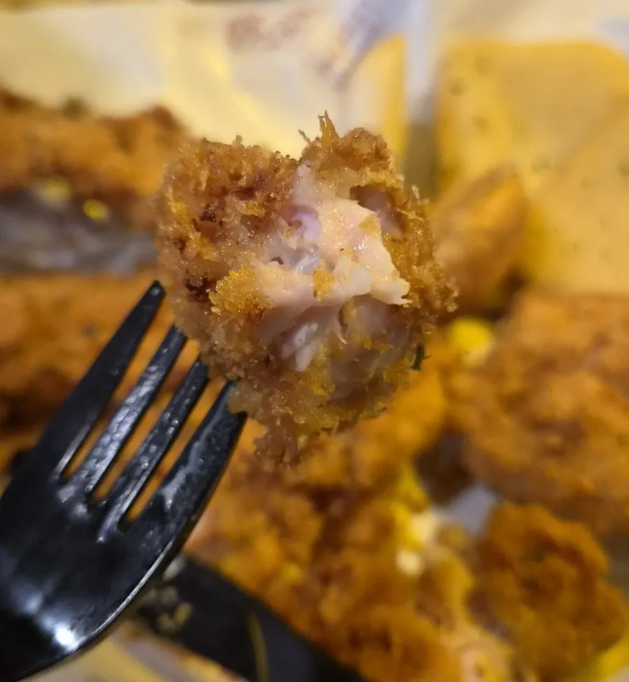 Close-up of the crunch chicken's crispy coating and moist interior