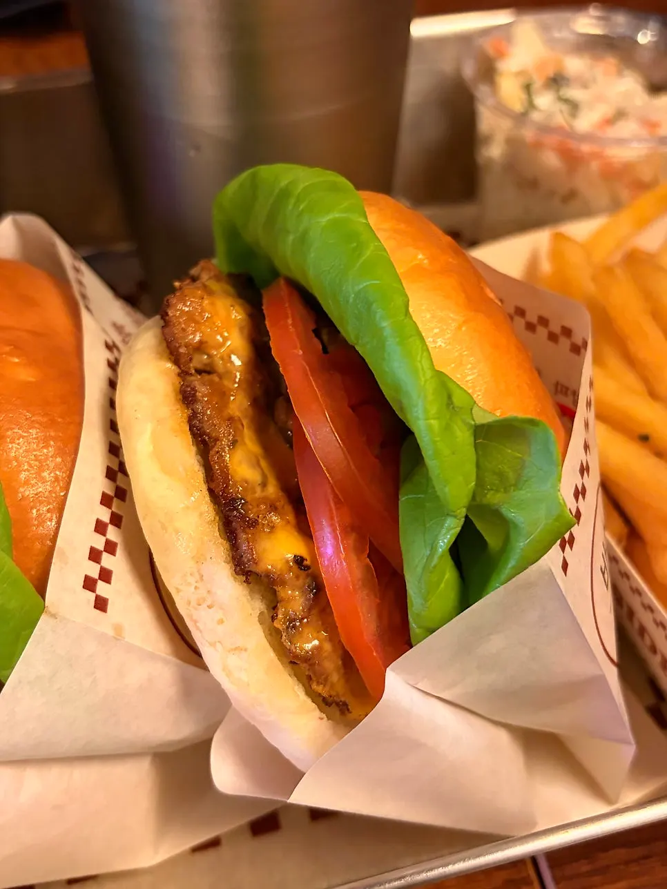 Basic BAS Burger with patty, tomato, and vegetables