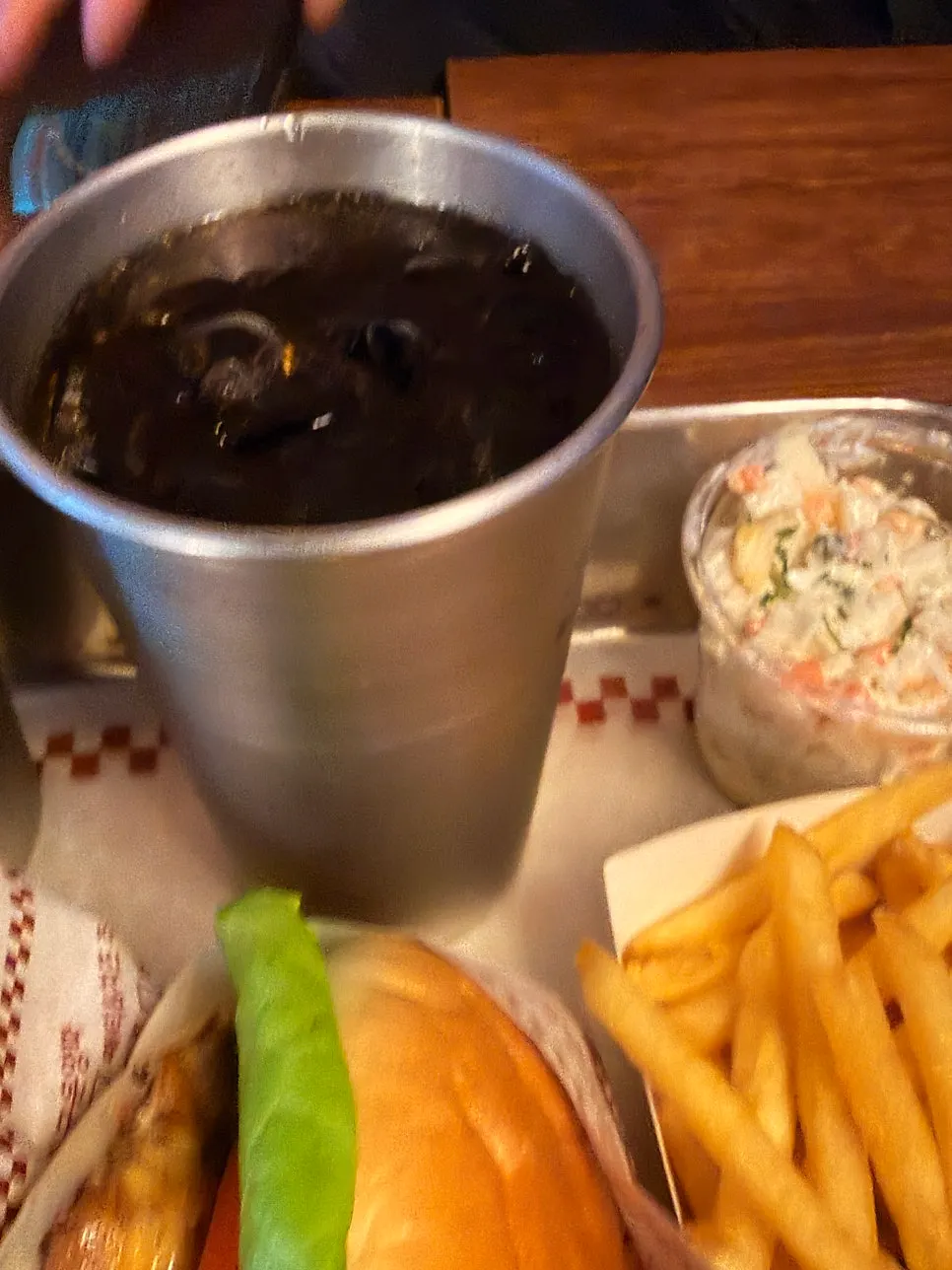Cola served in a stainless steel cup