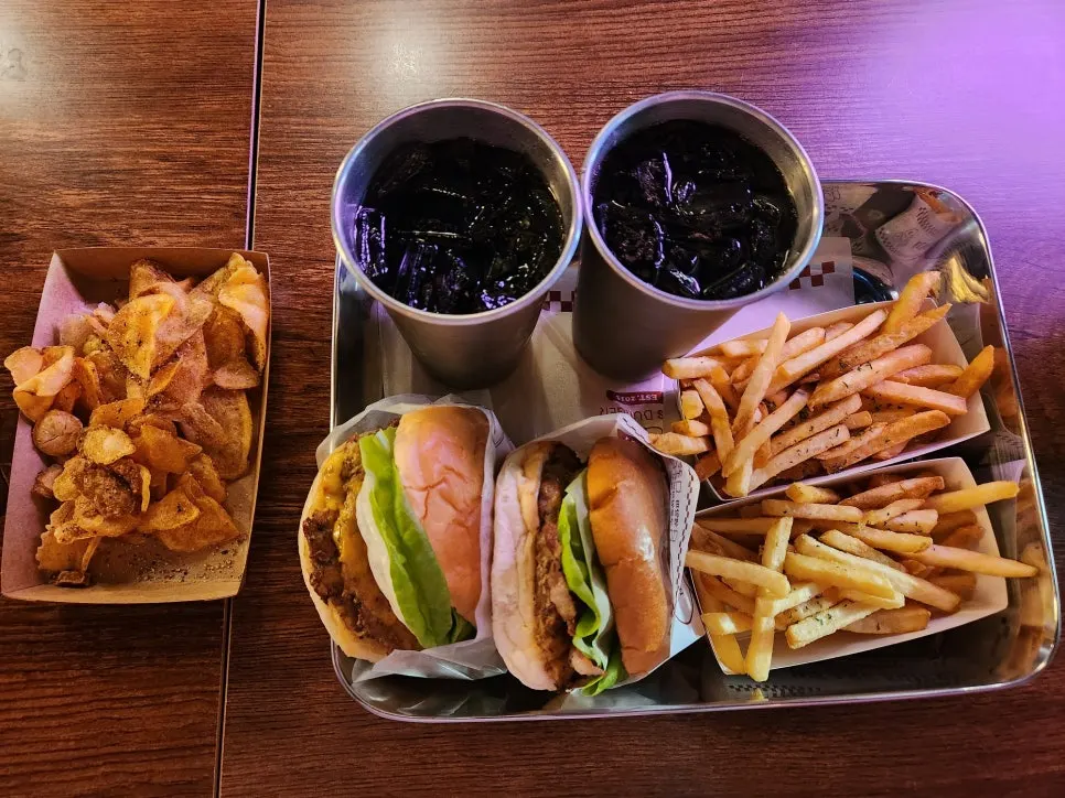A full spread of ordered burgers and sides