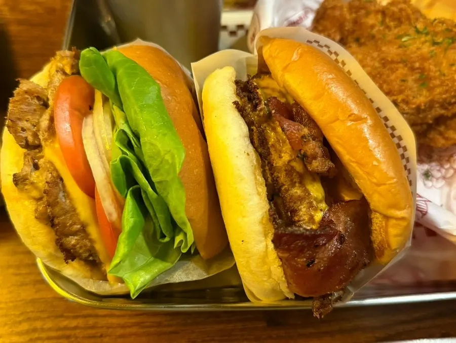 Handmade burger and sides set up on the table at BAS Burger