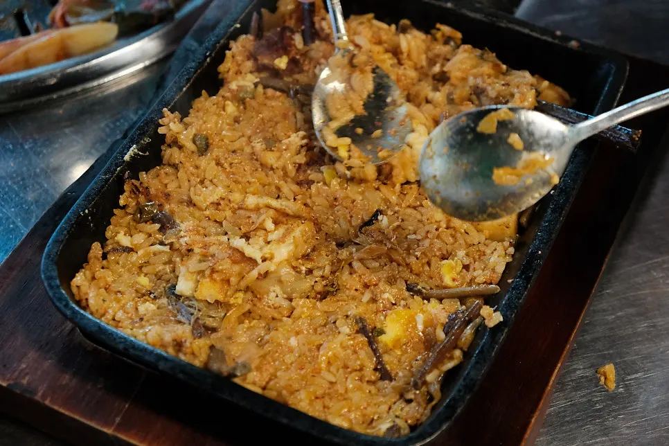Cubed fried rice shaped like a charcoal briquette