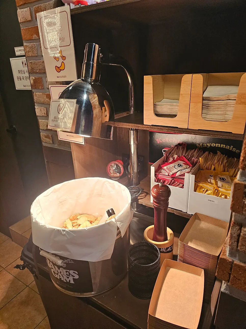 Self-serve potato chips scooped into a paper box